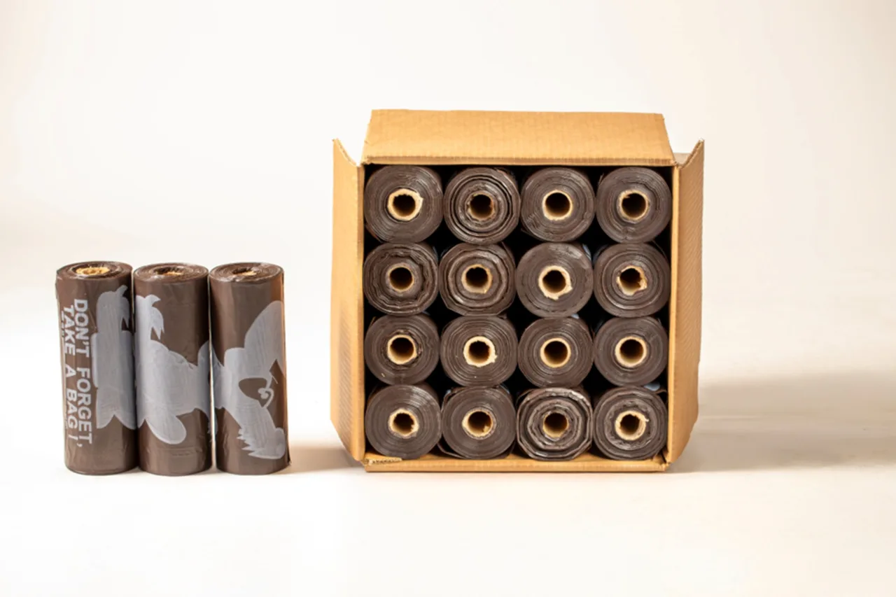 Dogi-Dogi 1.0 mil pet waste bag rolls displayed beside an open case