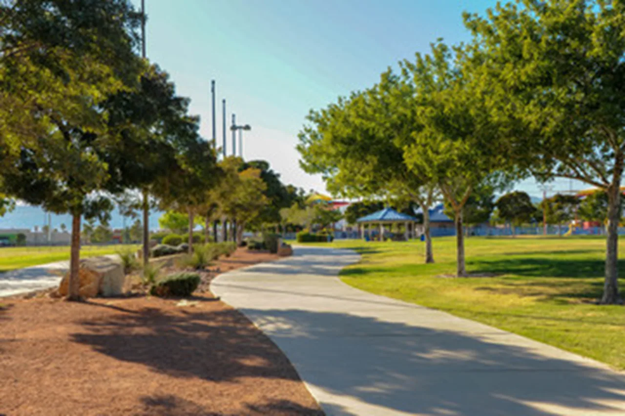 Landscaped Las Vegas park walkway representing local pet waste station service environments